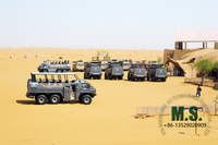 //irrorwxhonmpli5m-static.micyjz.com/cloud/lkBpiKoklrSRiljnpjljjo/desert-cruiser-bus-in-tourism-area.jpg