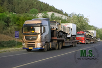 //irrorwxhonmpli5m-static.micyjz.com/cloud/lrBpiKoklrSRjlikpmojjq/Chinese-tractor-truck-carrying-the-truck-to-ship-out.jpg